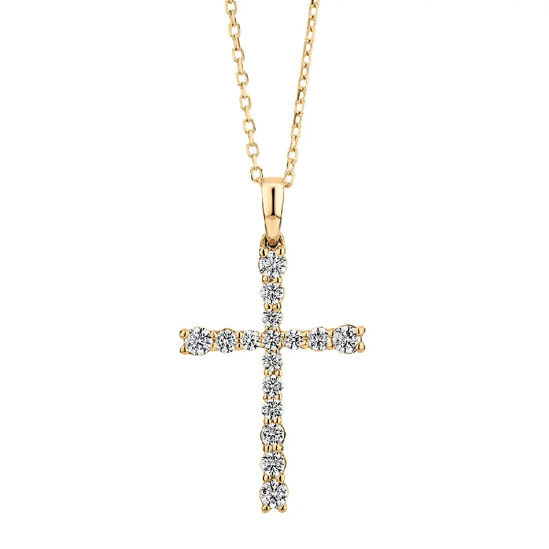 wave-shaped necklace-Cross pendant with 0.25 carats* of diamond simulants in 10 carat yellow gold